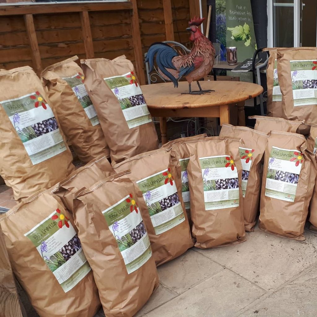 bags of Wassledine's charcoal ready for sale
