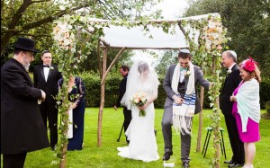 A 'Chuppah' in use at a wedding. A traditional canopy used in Jewish and increasingly, other marriage services